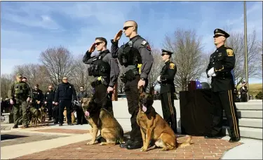  ?? BILL UHRICH —MEDIANEWS GROUP ?? Lancaster County Sheriff’s Office K-9officers salute the Pagerly family in honor of their late K-9Jynx during memorial services Monday at the Berks County FOP Memorial at the Berks County Heritage Center.