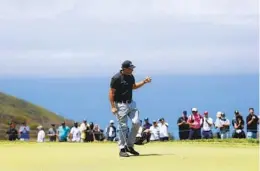  ?? K.C. ALFRED U-T ?? Phil Mickelson, who shot an opening-round 4-over 75, gives a thumbs-up to fans on the 17th hole of the U.S. Open at Torrey Pines on Thursday.