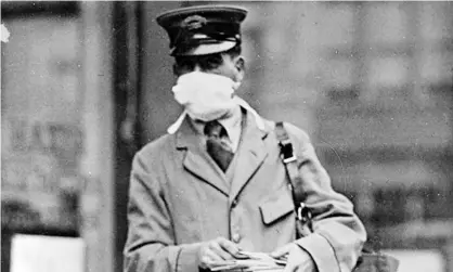  ??  ?? A New York mail worker wearing a mask designed to stop infection during the 1918 Spanish flue outbreak. Photograph: New York National Guard Handout/EPA