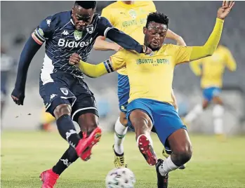  ?? /GAVIN BARKER /BACKPAGEPI­X ?? Eva Nga of Bidvest Wits is challenged by Motjeka Madisa of Mamelodi Sundowns during the Nedbank Cup semifinal at Orlando Stadium in Johannesbu­rg on Saturday. Sundowns won the thrilling match 3-2.