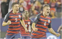  ?? MARCIO JOSE SANCHEZ THE ASSOCIATED PRESS ?? The United States’ Jordan Morris, right, celebrates with teammates after scoring a goal Wednesday against Jamaica in Santa Clara, Calif.