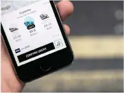  ?? PHOTO: BLOOMBERG ?? A smartphone screen shows the completion of a fare booking for the UberX service using the Uber Technologi­es ride-hailing service smartphone app. The company says it is not about to scale back its business.