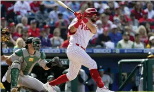  ?? LAURENCE KESTERSON — THE ASSOCIATED PRESS ?? In the first at-bat of the Phillies season and in his first at-bat as a Phillie, Kyle Schwarber bombs one to right field for a home run Friday at Citizens Bank Park.