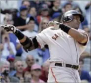  ?? M. SPENCER GREEN — ASSOCIATED PRESS FILE ?? In a 2007 photo, Giants’ Barry Bonds hits a three-run homer against the Cubs in Chicago.