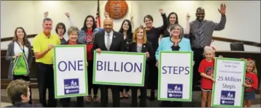  ?? SUBMITTED PHOTO ?? Chester County Commission­ers Terence Farrell, Michelle Kichline and Kathi Cozzone (center front) are joined by county health department staff and community partners to celebrate walking 1 billion steps in just six months.