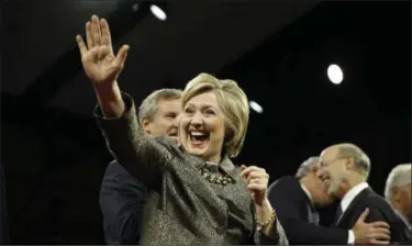  ?? THE ASSOCIATED PRESS ?? Hillary Clinton waves during her presidenti­al primary election night rally in Philadelph­ia on Tuesday.