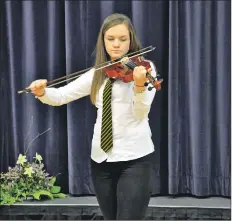  ?? 01_A13concert­06 ?? Elyse Aitken performs The Battle of Waterloo on the fiddle.