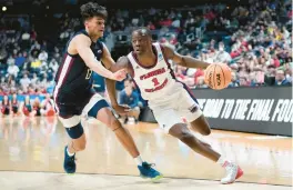  ?? PAUL SANCYA/AP ?? Florida Atlantic guard Johnell Davis drives against Fairleigh Dickinson forward Jo’el Emanuel on Sunday.