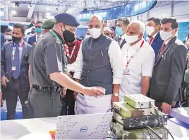  ?? PTI ?? Defence Minister Rajnath Singh inspects a stall at the India Pavilion during Aero India 2021 in Yelahanka, Bengaluru, on Wednesday