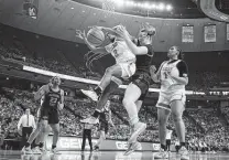  ?? Eric Gay / Associated Press ?? Aliyah Matharu (2) of Texas scrambles for a rebound during the final regular-season game at the Erwin Center in Austin.