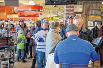  ?? COLIN CHISHOLM ?? Dozens of people lined up to meet Wendel Clark, who was one of two celebrity players that took part in the annual Long Pond Hockey Heritage Classic. For more weekend coverage, turn to page B12.