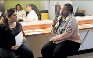  ??  ?? Junior Emari thinks as she talks about “thorns and roses” during a WOW counseling session on Monday at Benito Juarez Community Academy. WOW serves about 2,400 young women in 40 Chicago schools.