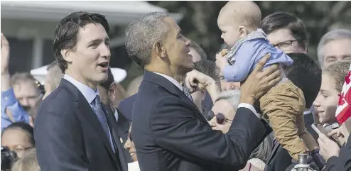  ?? ANDREW HARNIK / THE ASSOCIATED PRESS; MARK WILSON / GETTY IMAGES; OLIVIER DOULIERY- POOL / GETTY IMAGES ?? Clockwise from top: Prime Minister Justin Trudeau thanks U. S. President Barack Obama at a news conference Thursday in the Rose Garden
of the White House; Obama and Trudeau exchange toasts during the state dinner; Obama holds a baby handed to him by...