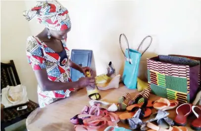  ?? Photo: CHRISTIANA T. ALABI ?? Vivian work on a shoe in Kaduna recently.