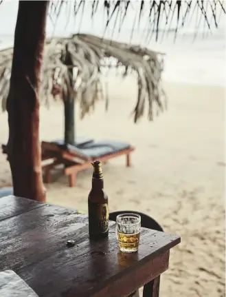  ??  ?? Postcard views of the Indian Ocean (right); Tangalle is the kind of place where you can enjoy a beer under a thatched umbrella