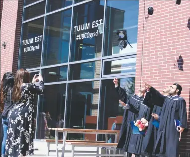  ?? Special to The Daily Courier ?? UBCO graduates throw their mortarboar­ds into the air to celebrate their success after receiving their degrees last year.