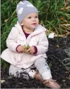  ??  ?? Stella Jury, 15 months, happily played in the garden at the festival.