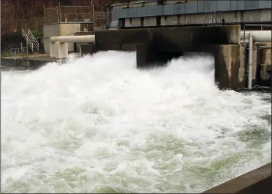  ?? JERRY R. TYSON/COURTESY PHOTOGRAPH ?? About 5,000 cubic feet of water per second is released into the Mokelumne River on Monday afternoon at the fish hatchery.