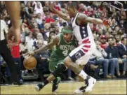  ?? ANDREW HARNIK — THE ASSOCIATED PRESS ?? Celtics guard Isaiah Thomas, left, drives on Wizards guard Bradley Beal on Thursday in Washington.