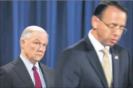  ?? BRENNER / THE NEW YORK TIMES ?? Attorney General Jeff Sessions looks on as Deputy Attorney General Rod Rosenstein gives a statement at the Department of Justice July 20. President Donald Trump continued his attacks on Sessions on July 25.TOM