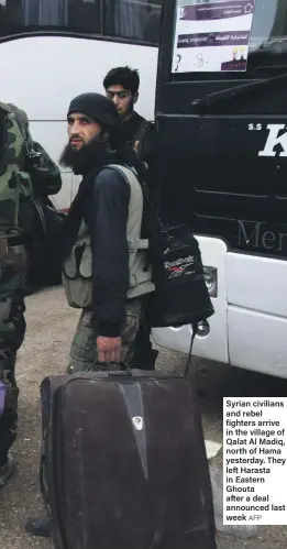  ?? AFP ?? Syrian civilians and rebel fighters arrive in the village of Qalat Al Madiq, north of Hama yesterday. They left Harasta in Eastern Ghouta after a deal announced last week