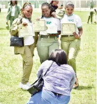  ?? Photo: Onyekachuk­wu Obi ?? Corps members pose for photograph
after their graduation in Abuja yesterday