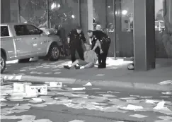  ?? Associated Press ?? ■ In this image taken from video by KDFW Fox 4, a man is detained after crashing his truck into the side of the Fox affiliate television station building on Wednesday in downtown Dallas. Despite the crash, nobody was hurt.