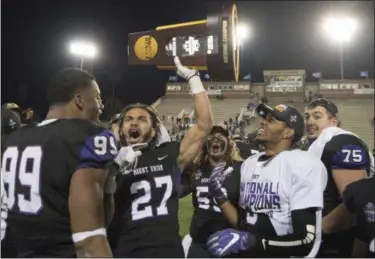  ?? LEE LUTHER JR. — THE ASSOCIATED PRESS ?? Mount Union’s Gabe Brown (27) celebrates with his teammates after defeating Mary Hardin-Baylor in the Amos Alonzo Stagg Bowl NCAA Division III championsh­ip on Dec. 15 in Salem, Va.