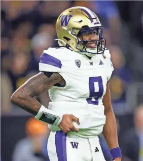  ?? MARK J. REBILAS/USA TODAY SPORTS ?? Washington quarterbac­k Michael Penix Jr. reacts after a play against Michigan during the fourth quarter of the title game.