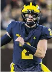  ?? TONY DING/ THE ASSOCIATED PRESS/FILE ?? Michigan’s Shea Patterson ran wild against Wisconsin.