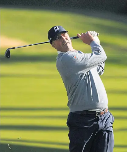  ??  ?? Matt Kuchar plays a shot on the 13th hole during the first round of the Genesis Invitation­al.