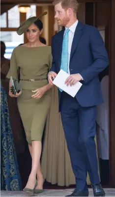  ?? DOMINIC LIPINSKI Reuters ?? Britain’s Prince Harry and Meghan, the Duchess of Sussex, stylish in olive green, leave the chapel after the christenin­g of Prince Louis. |