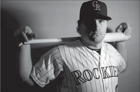  ?? AP ?? Colorado Rockies infielder Daniel Murphy poses at the team’s spring training facility in Scottsdale, Arizona, on Wednesday. Accustomed to playing in the postseason, Murphy focused his free-agent checklist on playoff contenders. When the ascendant Rockies showed as much interest in the player as he had in them, working out the details of a two-year deal worth $24 million was relatively simple.