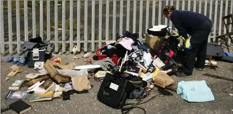  ??  ?? ABOVE: A council waste enforcemen­t officer examining waste dumped on the North Quays in Arklow last week. LEFT: The used and unused needles found in Glenart.