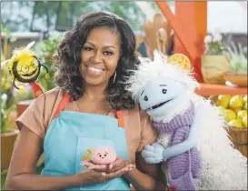  ??  ?? Michelle Obama in “0affles + Mochi”