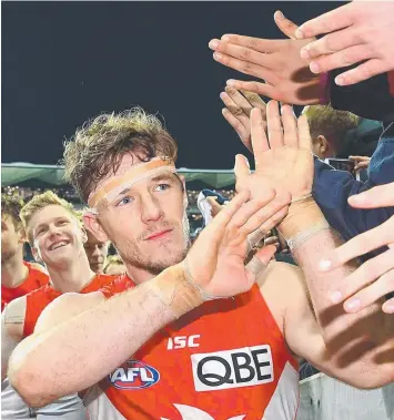 ?? Picture: QUINN ROONEY ?? WELL DONE: Luke Parker high fives fans after last night’s big win over Geelong.