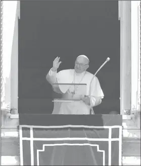  ?? AP Photo/Alessandra Tarantino ?? Pope Francis: Pope Francis blesses the crowd as he recites the Angelus noon prayer from the window of his studio overlookin­g St.Peter's Square, at the Vatican, Sunday, July 1, 2018. Pope Francis has lamented intensifie­d attacks in southern Syria,...