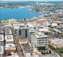  ?? Nikki Kahn Washington Post ?? AMAZON is proposing to replicate its sprawling Seattle campus, center, which at 8.1 million square feet casts the largest urban corporate footprint in America.