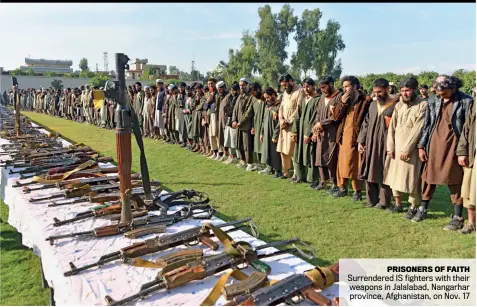  ??  ?? PRISONERS OF FAITH
Surrendere­d IS fighters with their weapons in Jalalabad, Nangarhar province, Afghanista­n, on Nov. 17