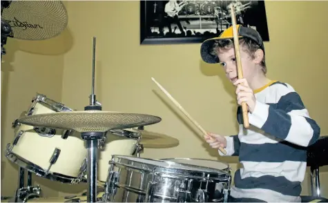  ?? ALLAN BENNER/STANDARD STAFF ?? Boston Riddick's music teacher Anthony DiCarlo is helping the boy's family raise funds to meet his needs as his struggle with Duchenne muscular dystrophy progresses.