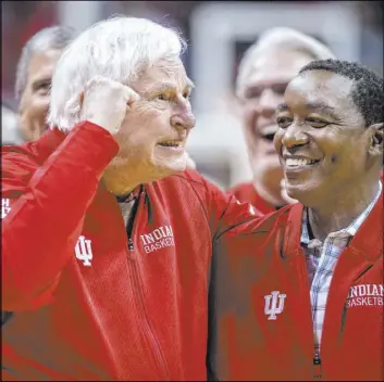  ?? Doug McSchooler The Associated Press ?? Former Indiana coach Bob Knight and guard Isiah Thomas attend a ceremony saluting the Hoosiers’ 1980 Big Ten title team Saturday at Simon Skjodt Assembly Hall. The appearance was Knight’s first at the school since his 2000 dismissal. Knight, 79, won 662 games and three national titles in 29 seasons at Indiana.