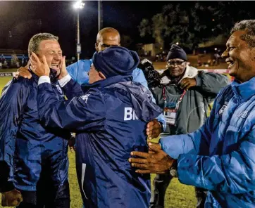  ??  ?? (Below) Hunt celebrates with Wits staff and club owner Brian Joffe.