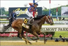  ?? AP photo ?? Mo Donegal, with jockey Irad Ortiz Jr. up, crosses the finish line to win the 154th running of the Belmont Stakes on Saturday.
