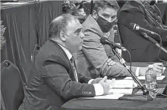  ?? CAPE BRETON POST ?? CBRM solicitor Demetri Kachafanas, left, addresses municipal council on Tuesday while planning director Michael Ruus looks on. Kachafanas was discussing the municipali­ty’s position on an outstandin­g freedom of informatio­n request about Port of Sydney developmen­t.