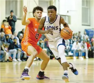  ??  ?? Junior guard Ismail Habib, driving past Young’s Elliott Sieger, led Lincoln Park with 18 points.