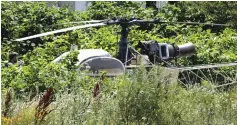  ?? — AFP photo ?? A French helicopter Alouette II abandoned by Faid in Gonesse, north of Paris after his escape from prison in Reau.