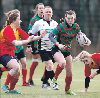  ??  ?? Rachel MacDonald makes a charge forward.