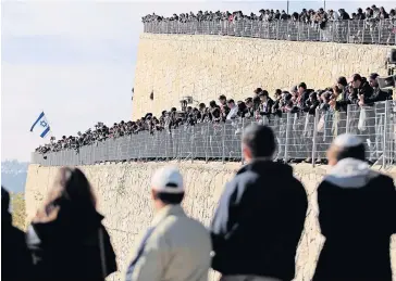  ?? REUTERS ?? Mourners gather on Tuesday for the burial ceremony in Jerusalem for the four French Jews — Yohan Cohen, Yoav Hattab, Philippe Braham and Francois-Michel Saada — killed in last Friday’s attack on a Paris market.