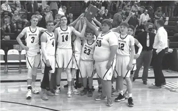  ?? Alex Eller ?? The Mullen boys basketball team celebratin­g their 44-27 victory over Sandhills Valley in the MNAC Championsh­ip on Jan. 30. The Broncos are currently second in the powerpoint­s put out by the NSAA behind Parkview Christian out of Lincoln.