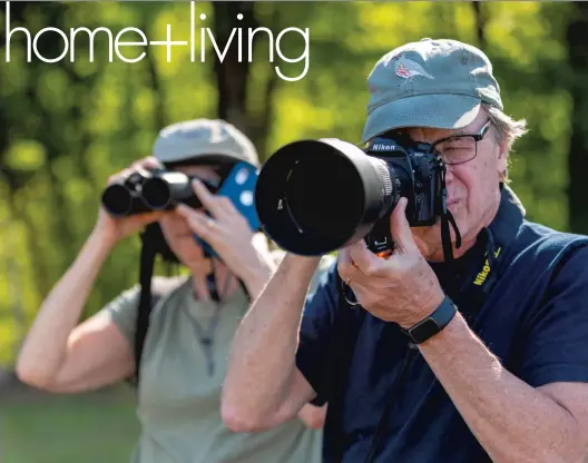  ?? ROBERT WILLETT/THE NEWS & OBSERVER ?? Anders and Beverly Gyllenhaal search for birds in April at Anderson Point Park, Raleigh.